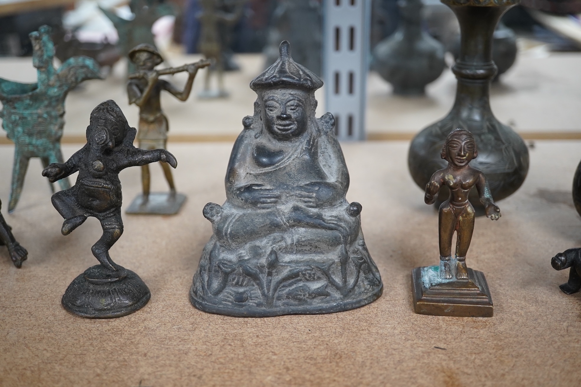 A group of Chinese and Indian bronze figures and vessels, 19th century and later, tallest 12cm. Condition - varies